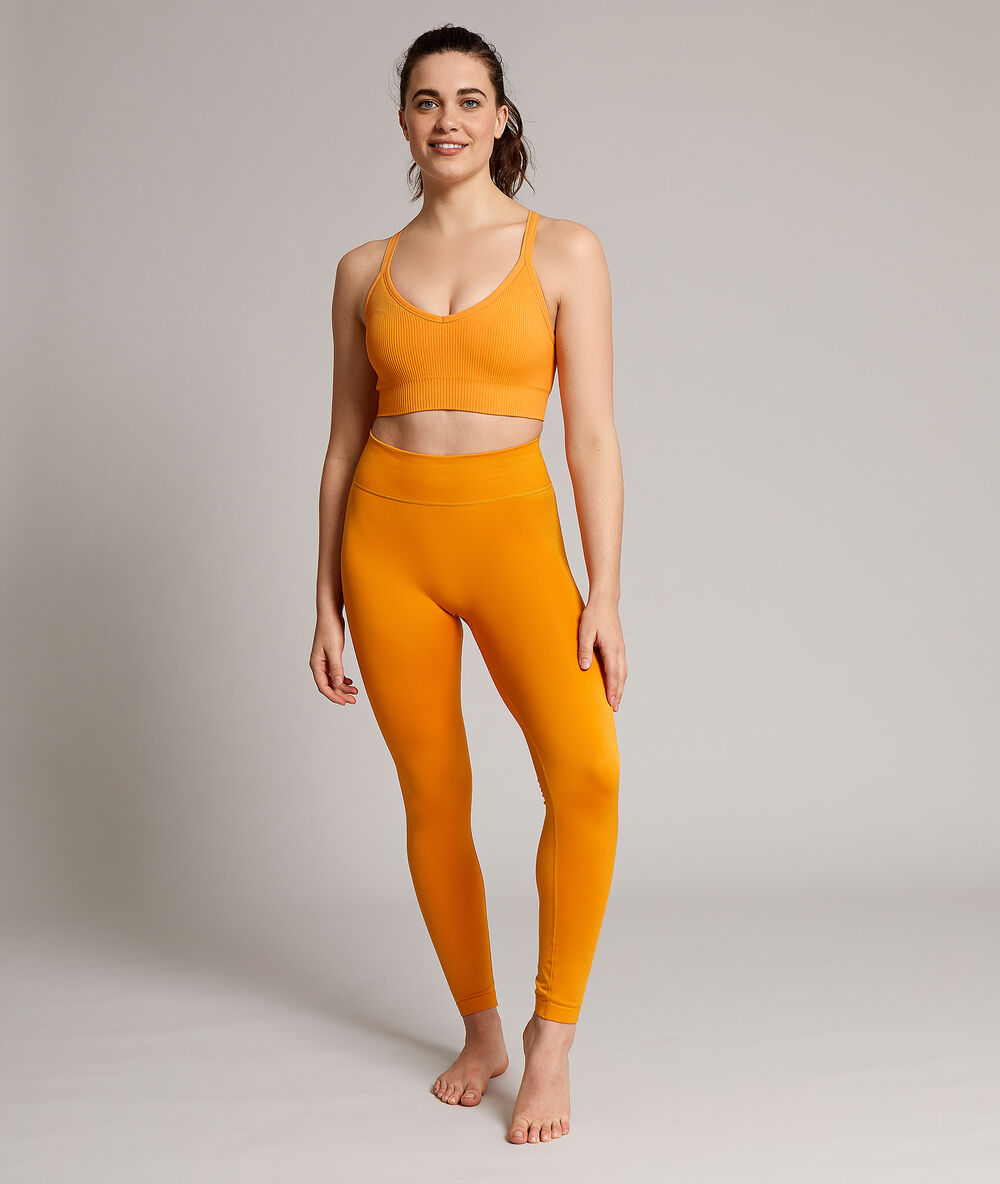 Lange nahtlose yoga-leggings ocker.