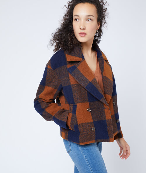 Manteau court &agrave; carreaux marine.
