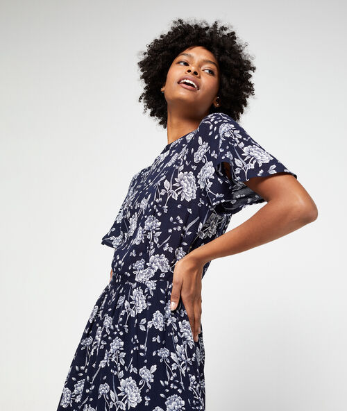 Robe longue dos ouvert à imprimé fleuri marine.