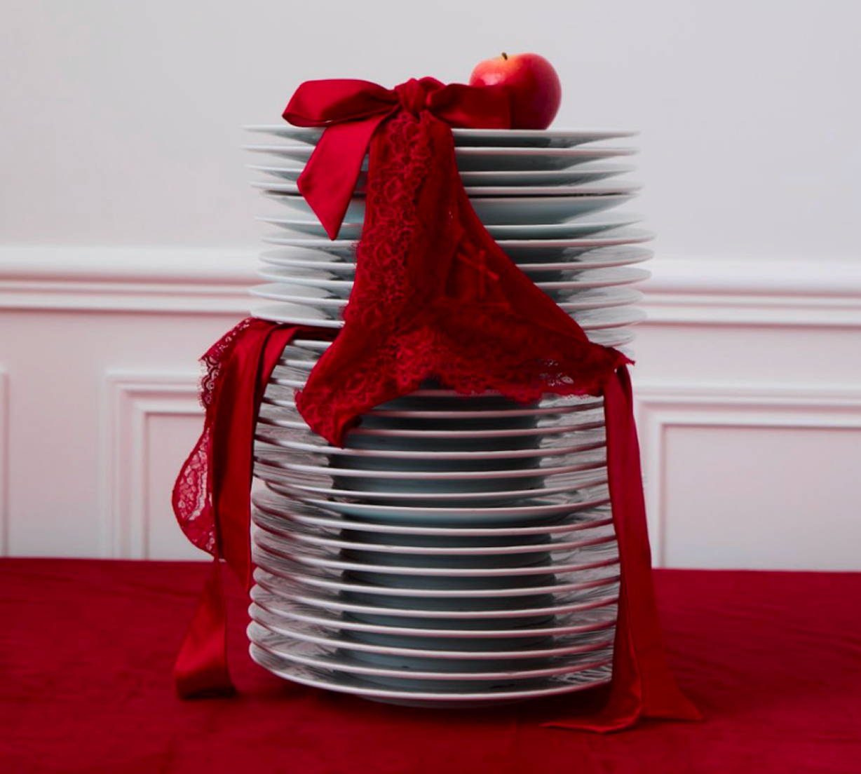 Love is a gift - Stack of plates with red ribbon